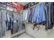 Organized closet featuring clothing racks, shelving with boxes, and tile floors at 1335 E June St # 107, Mesa, AZ 85203