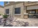 Condominium exterior featuring desert landscaping and a private patio with sliding glass doors at 1335 E June St # 107, Mesa, AZ 85203