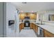 Bright kitchen with stainless steel appliances, light wood cabinetry and white countertops at 1335 E June St # 107, Mesa, AZ 85203