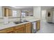 Bright kitchen featuring stainless steel sink, ample counter space, and modern appliances at 1335 E June St # 107, Mesa, AZ 85203