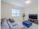 Cozy living room with large windows, neutral paint, comfortable seating and tile floors at 1335 E June St # 107, Mesa, AZ 85203