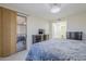 Relaxing bedroom with sliding glass door, comfortable bed, and dresser at 1335 E June St # 107, Mesa, AZ 85203