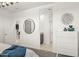 Bright bedroom featuring white walls, a large bed and doorways to other areas of the home at 1342 W Hess Ave, Coolidge, AZ 85128