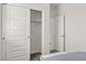 Bright bedroom featuring a closet with sliding doors and neutral carpeting at 1342 W Hess Ave, Coolidge, AZ 85128