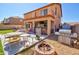 Inviting backyard featuring a built-in bar, BBQ grill, and ample space for outdoor entertaining at 1556 E Gabrilla Dr, Casa Grande, AZ 85122