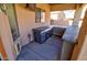 Outdoor kitchen has modern appliances and lots of counter space for entertaining guests at 1556 E Gabrilla Dr, Casa Grande, AZ 85122