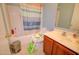 Practical full bathroom with vanity, toilet, and tiled shower-tub combination at 1556 E Gabrilla Dr, Casa Grande, AZ 85122