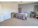 Spacious bedroom with a comfortable bed, dresser, and ample natural light, creating a serene retreat at 1556 E Gabrilla Dr, Casa Grande, AZ 85122