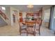 Inviting dining area with a round table, chairs, and kitchen in the background, creating a warm gathering space at 1556 E Gabrilla Dr, Casa Grande, AZ 85122