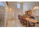 Large dining room with high ceilings, tile floors, and a wooden table with chairs at 1556 E Gabrilla Dr, Casa Grande, AZ 85122
