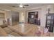 Cozy living room with a large TV, comfortable seating, and a ceiling fan, ideal for relaxation and entertainment at 1556 E Gabrilla Dr, Casa Grande, AZ 85122