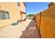 A spacious side yard with ample room for storage and functionality, connecting seamlessly to the backyard at 1556 E Gabrilla Dr, Casa Grande, AZ 85122
