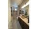 This bathroom features a combination shower and tub, and a wide dark vanity at 15801 W Cielo Grande Ave, Surprise, AZ 85387