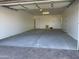 Large two car garage with automatic door, side entry door, and window at 15801 W Cielo Grande Ave, Surprise, AZ 85387