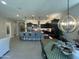 Modern kitchen with stainless steel appliances, pendant lighting, and a large island with barstool seating at 15801 W Cielo Grande Ave, Surprise, AZ 85387
