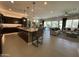 Contemporary kitchen featuring a large island, stainless appliances, and seamless flow to the living space at 15801 W Cielo Grande Ave, Surprise, AZ 85387