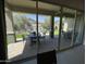 Covered patio with comfortable seating, perfect for outdoor entertaining and relaxation with a view of the landscaped yard at 15801 W Cielo Grande Ave, Surprise, AZ 85387