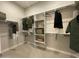 A spacious walk-in closet with built-in shelving and racks offers ample storage at 15801 W Cielo Grande Ave, Surprise, AZ 85387