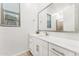 Clean bathroom with a large mirror, white cabinets, and a shower-tub combination at 16852 W Creedance Blvd, Surprise, AZ 85387