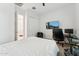 Bright bedroom with a home office setup and white walls, perfect for work or relaxation at 16852 W Creedance Blvd, Surprise, AZ 85387