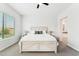Bright bedroom with neutral décor and a large window at 16852 W Creedance Blvd, Surprise, AZ 85387