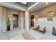 Inviting courtyard with a private entrance and a charming seating area with two chairs at 16852 W Creedance Blvd, Surprise, AZ 85387