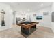 Large game room with pool table and bar, perfect for entertaining, relaxation and Gathering fun at 16852 W Creedance Blvd, Surprise, AZ 85387