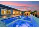 Backyard featuring a pool, an outdoor bar and a patio with a seating and dining area at 16852 W Creedance Blvd, Surprise, AZ 85387