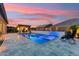 Sparkling pool and patio with luxurious outdoor seating and barbecue, perfect for enjoying Arizona sunsets at 16852 W Creedance Blvd, Surprise, AZ 85387