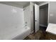 Bathroom featuring a white tiled shower/tub and tiled flooring at 1804 W Kristal Way, Phoenix, AZ 85027