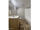 Bathroom with tile flooring, wood vanity, and combination shower and bathtub at 1804 W Kristal Way, Phoenix, AZ 85027