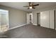 Bedroom featuring neutral carpet, ceiling fan, and a sliding door closet at 1804 W Kristal Way, Phoenix, AZ 85027