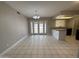 Tile dining room with French doors to backyard and a bar area at 1804 W Kristal Way, Phoenix, AZ 85027