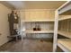 Garage with water heater, storage and shelving at 1804 W Kristal Way, Phoenix, AZ 85027