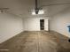 Spacious garage with a pedestrian door and storage area at 1804 W Kristal Way, Phoenix, AZ 85027