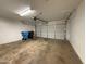 Spacious garage with automatic door and trash cans at 1804 W Kristal Way, Phoenix, AZ 85027