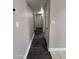Hallway features wood-look floors, leading to different rooms in the home at 1804 W Kristal Way, Phoenix, AZ 85027