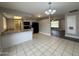 Kitchen featuring a breakfast bar, black appliances, and tile flooring at 1804 W Kristal Way, Phoenix, AZ 85027