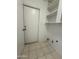 Laundry room with shelving and access to the outside at 1804 W Kristal Way, Phoenix, AZ 85027