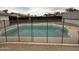 Fenced pool in backyard features a concrete surround, offering a private retreat at 1804 W Kristal Way, Phoenix, AZ 85027
