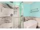This modern bath features an oversized shower with glass door and free standing tub at 1912 S Colt Dr, Gilbert, AZ 85295
