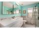 This modern bath features sleek cabinetry, stylish tile and an oversized shower with glass door at 1912 S Colt Dr, Gilbert, AZ 85295