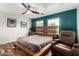 Modern bedroom with wood accents, natural light, and comfortable seating at 1912 S Colt Dr, Gilbert, AZ 85295