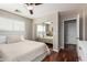 This light and airy bedroom offers mirrored closet doors and views into the ensuite bath at 1912 S Colt Dr, Gilbert, AZ 85295