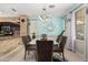 Elegant dining area featuring modern lighting, stylish furniture, and a view into kitchen at 1912 S Colt Dr, Gilbert, AZ 85295