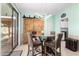 Bright dining area featuring modern light fixture, sliding glass doors to backyard at 1912 S Colt Dr, Gilbert, AZ 85295