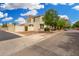 Street view of home highlighting side yard, neutral color scheme, landscaping and well-maintained surroundings at 1912 S Colt Dr, Gilbert, AZ 85295