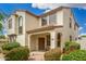 Inviting two-story home featuring a cozy covered porch and well-maintained desert landscaping at 1912 S Colt Dr, Gilbert, AZ 85295