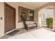 Cozy front porch with comfortable bench seating, offering a welcoming entrance to the home at 1912 S Colt Dr, Gilbert, AZ 85295
