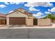 Home featuring a two-car garage and an enclosed private backyard at 1912 S Colt Dr, Gilbert, AZ 85295